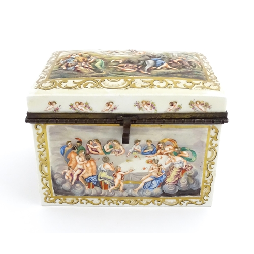 72 - A Capodimonte porcelain casket / box decorated in relief with Bacchanalian scenes, to include huntin... 