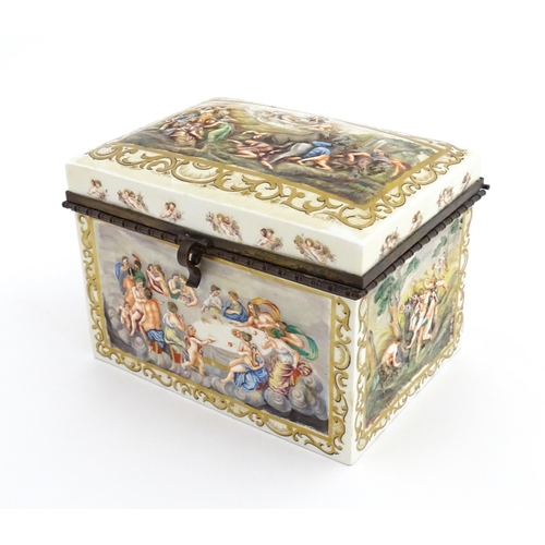 72 - A Capodimonte porcelain casket / box decorated in relief with Bacchanalian scenes, to include huntin... 