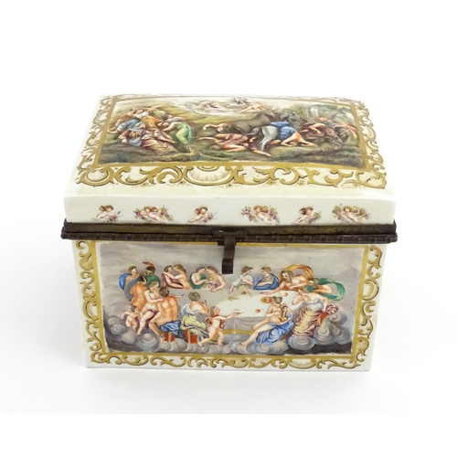 72 - A Capodimonte porcelain casket / box decorated in relief with Bacchanalian scenes, to include huntin... 