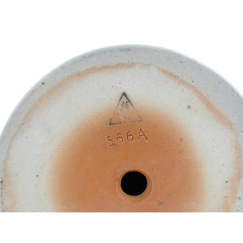 75 - A German Westerwald salt glazed ewer / flask with double headed eagle detail. Impressed under 566A. ... 