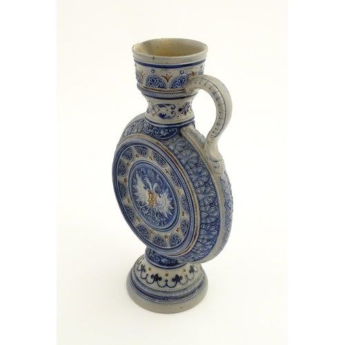 75 - A German Westerwald salt glazed ewer / flask with double headed eagle detail. Impressed under 566A. ... 