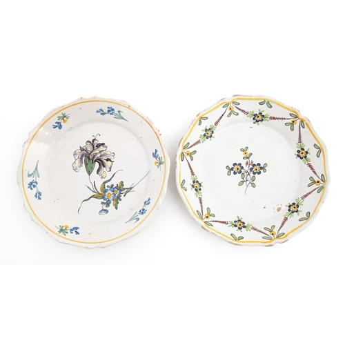 77 - Two Continental faience plates of shaped form with hand painted flower decoration. Approx. 9