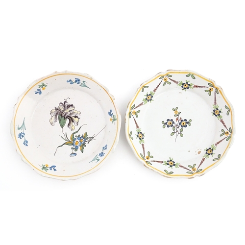 77 - Two Continental faience plates of shaped form with hand painted flower decoration. Approx. 9