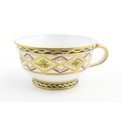 78 - A French 19thC Charles Philippe of Paris porcelain tea cup and saucer with banded decoration and gil... 