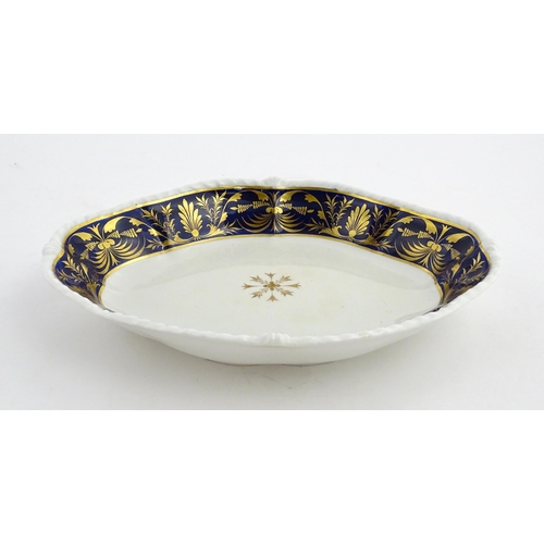 84 - A Derby dish of shaped form with cobalt blue border with gilt foliate decoration. Together with a Co... 