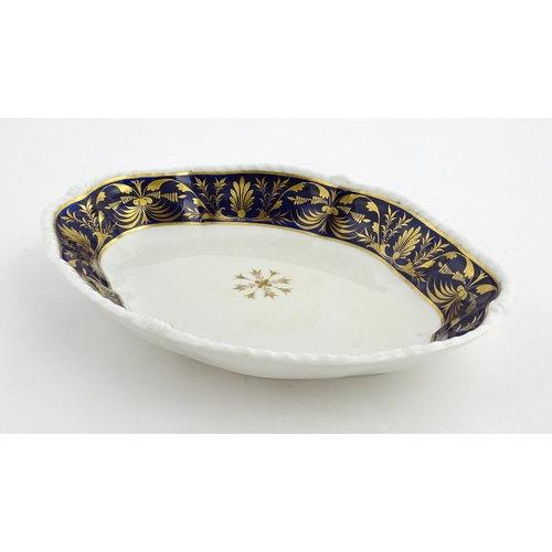 84 - A Derby dish of shaped form with cobalt blue border with gilt foliate decoration. Together with a Co... 