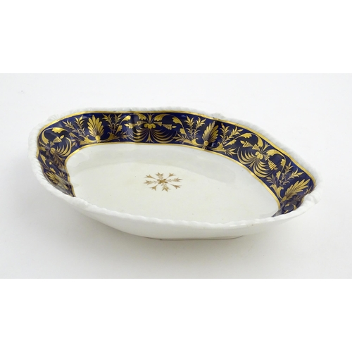 84 - A Derby dish of shaped form with cobalt blue border with gilt foliate decoration. Together with a Co... 