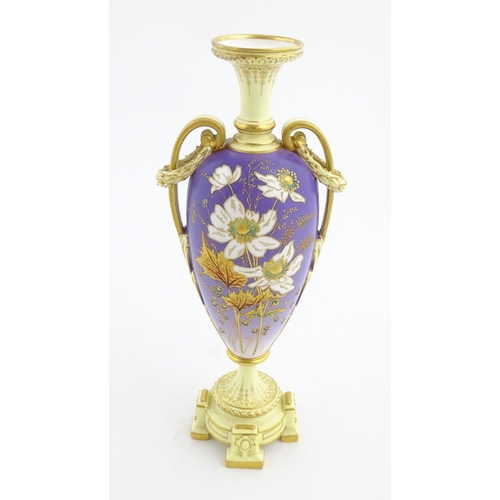 87 - A Royal Worcester cream and purple vase of pedestal baluster form with twin gilt acanthus leaf handl... 