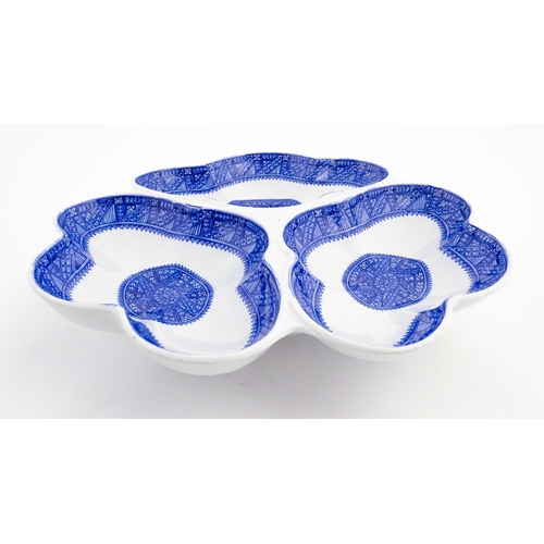 89 - A Royal Worcester blue and white hors d'oeuvres / serving dish of shaped form with three sections. M... 