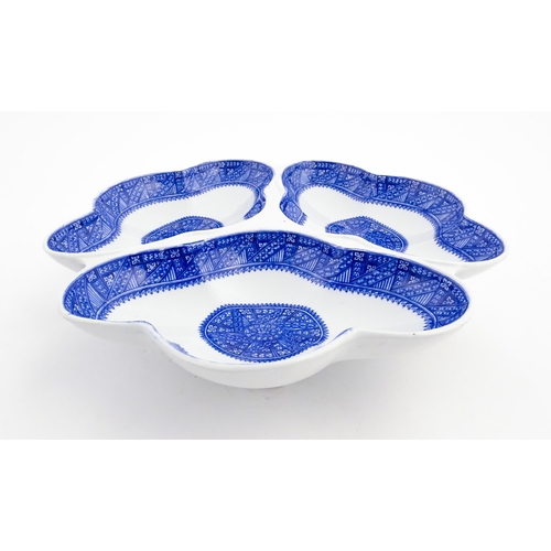 89 - A Royal Worcester blue and white hors d'oeuvres / serving dish of shaped form with three sections. M... 