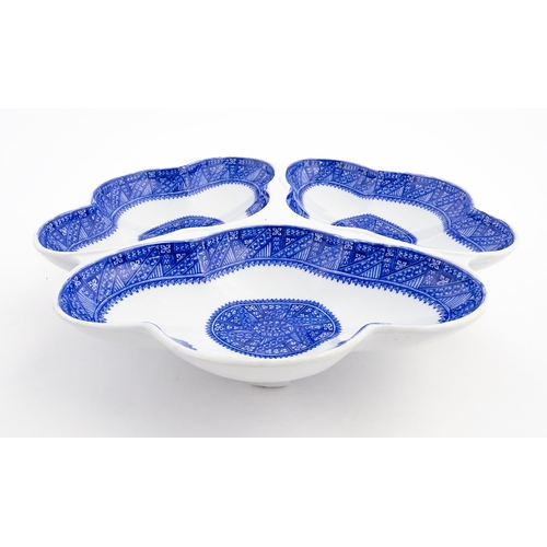 89 - A Royal Worcester blue and white hors d'oeuvres / serving dish of shaped form with three sections. M... 