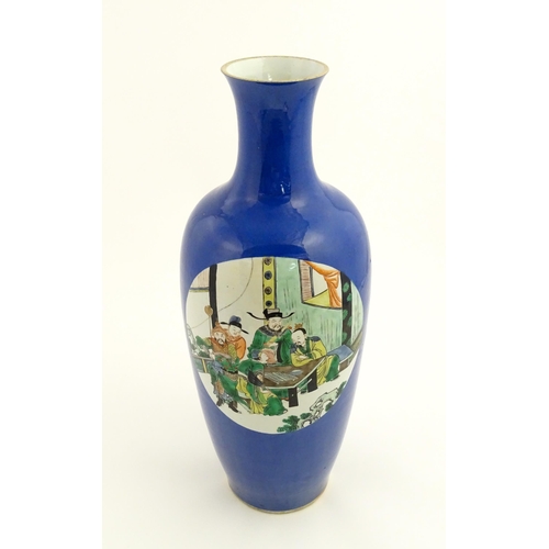 9 - A large Chinese famille verte vase with a blue ground decorated with scholar figures with a sage in ... 