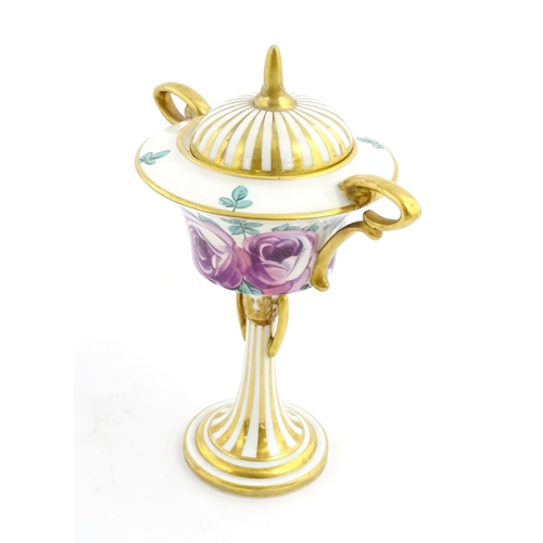 91 - A Minton Art Nouveau twin handled pedestal urn and cover with twin handles, the body with hand paint... 