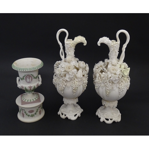 92 - A pair of Samuel Alcock bisque / parian ewers with decorated with encrusted flowers and relief bunch... 