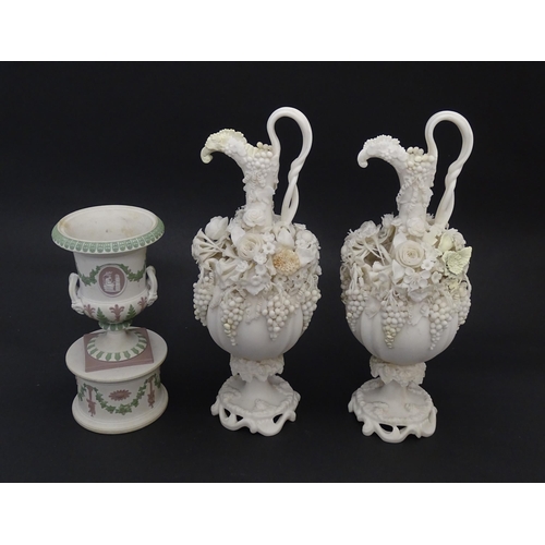 92 - A pair of Samuel Alcock bisque / parian ewers with decorated with encrusted flowers and relief bunch... 