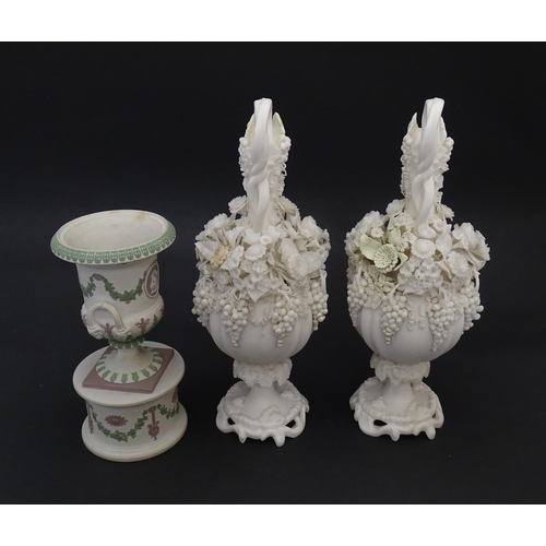 92 - A pair of Samuel Alcock bisque / parian ewers with decorated with encrusted flowers and relief bunch... 