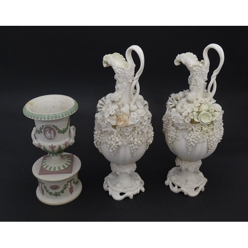 92 - A pair of Samuel Alcock bisque / parian ewers with decorated with encrusted flowers and relief bunch... 