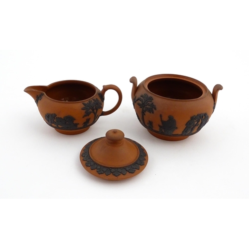 93 - A quantity of Wedgwood Rosso Antico / terracotta jasperware tea wares with applied black Classical f... 