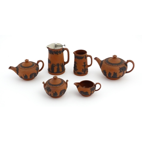 93 - A quantity of Wedgwood Rosso Antico / terracotta jasperware tea wares with applied black Classical f... 