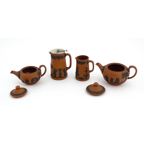 93 - A quantity of Wedgwood Rosso Antico / terracotta jasperware tea wares with applied black Classical f... 