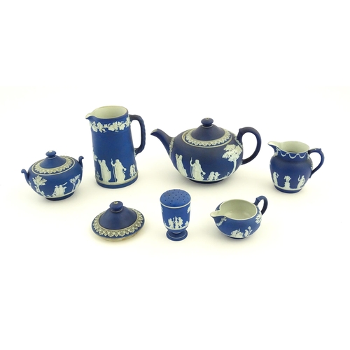 94 - A quantity of Wedgwood dark blue jasperware tea wares with applied white Classical figures and motif... 