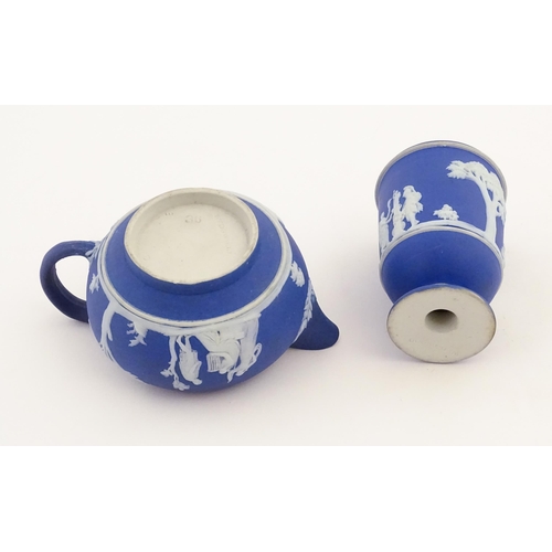 94 - A quantity of Wedgwood dark blue jasperware tea wares with applied white Classical figures and motif... 