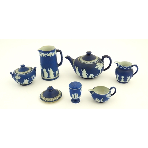 94 - A quantity of Wedgwood dark blue jasperware tea wares with applied white Classical figures and motif... 