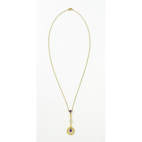 740 - A yellow metal pendant and chain set with amethyst and pearl. Approx 16