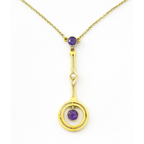 740 - A yellow metal pendant and chain set with amethyst and pearl. Approx 16