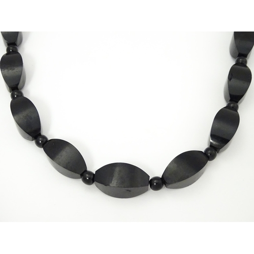 774 - A vintage necklace of graduated black beads. Approx. 28