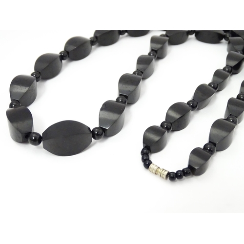 774 - A vintage necklace of graduated black beads. Approx. 28