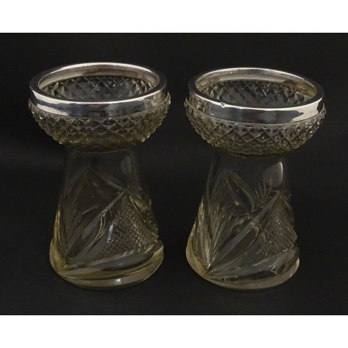 258 - A pair of cut glass vases with stylised thistle detail and silver rims hallmarked Birmingham 1906, m... 