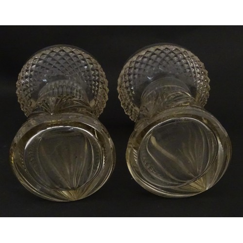 258 - A pair of cut glass vases with stylised thistle detail and silver rims hallmarked Birmingham 1906, m... 