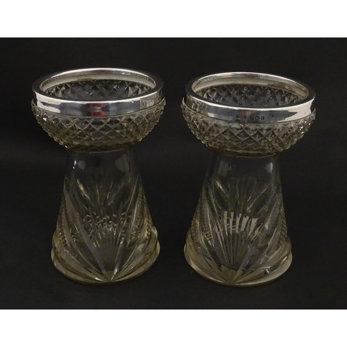 258 - A pair of cut glass vases with stylised thistle detail and silver rims hallmarked Birmingham 1906, m... 