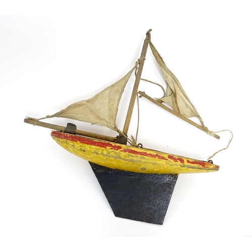 863 - Toys: A quantity of assorted vintage toys to include a scratch built wooden model of a boat, a tinpl... 