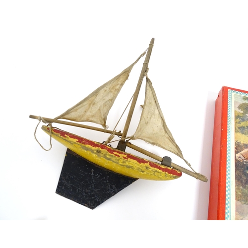 863 - Toys: A quantity of assorted vintage toys to include a scratch built wooden model of a boat, a tinpl... 