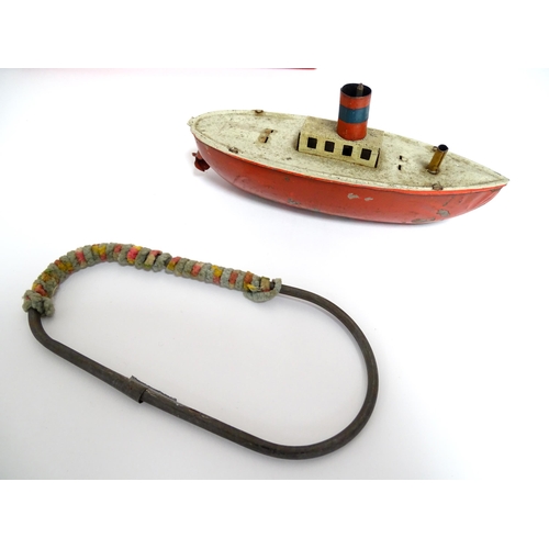 863 - Toys: A quantity of assorted vintage toys to include a scratch built wooden model of a boat, a tinpl... 