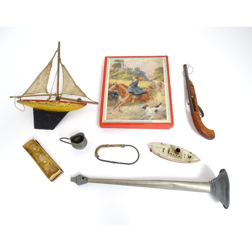 863 - Toys: A quantity of assorted vintage toys to include a scratch built wooden model of a boat, a tinpl... 