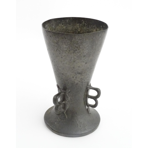 1001 - A Liberty & Co. Arts & Crafts Tudric pewter vase of flared form with hammered decoration and three d... 