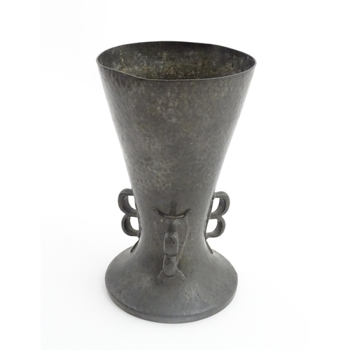 1001 - A Liberty & Co. Arts & Crafts Tudric pewter vase of flared form with hammered decoration and three d... 