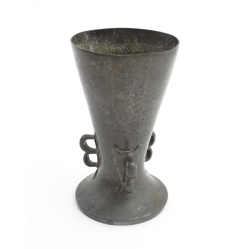 1001 - A Liberty & Co. Arts & Crafts Tudric pewter vase of flared form with hammered decoration and three d... 