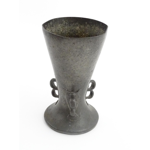 1001 - A Liberty & Co. Arts & Crafts Tudric pewter vase of flared form with hammered decoration and three d... 