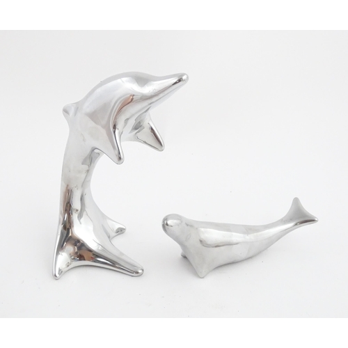 1007 - Two Canadian Hoselton sculptures, one modelled as a sealion, the other as a dolphin. Dolphin approx.... 