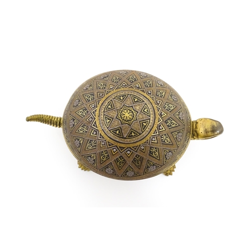 1014 - A 20thC novelty clockwork counter bell modelled as a tortoise, the shell with Damascene style decora... 