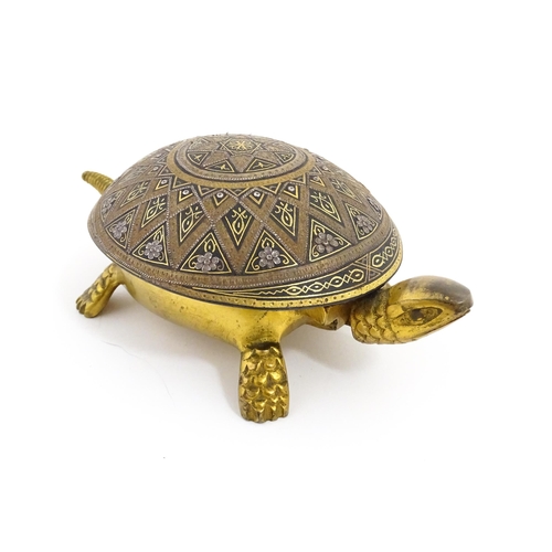 1014 - A 20thC novelty clockwork counter bell modelled as a tortoise, the shell with Damascene style decora... 