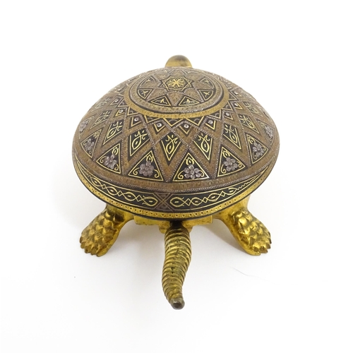 1014 - A 20thC novelty clockwork counter bell modelled as a tortoise, the shell with Damascene style decora... 