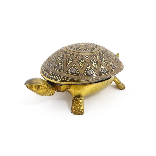 1014 - A 20thC novelty clockwork counter bell modelled as a tortoise, the shell with Damascene style decora... 