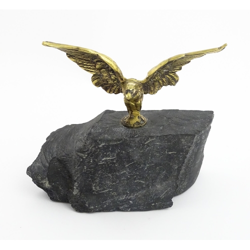 1016 - A 20thC cast brass eagle with outstretched wings mounted on a hardstone. Approx. 8 1/2