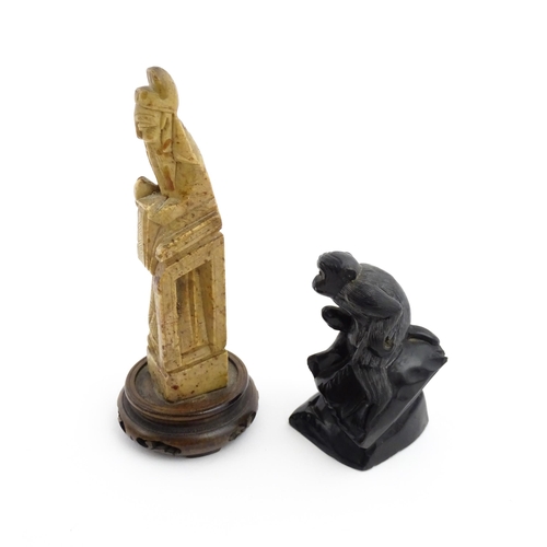 1028 - Two Chinese soapstone carvings, one modelled as a monkey, the other as a stylised sage / scholar fig... 