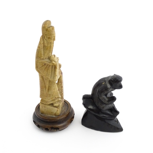 1028 - Two Chinese soapstone carvings, one modelled as a monkey, the other as a stylised sage / scholar fig... 